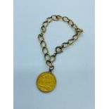 An 1897 Half sovereign on 9ct gold bracelet (13.82g Total weight)