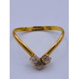 An 18ct yellow gold three stone wishbone ring.(1.66g)