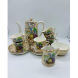 A tea set to include sugar bowl, milk jug, six cups and sauces by BCM Nelson ware
