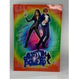 An Austin Powers promotional card signed by Elizabeth Hurley.