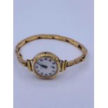 A Ladies Omer 9ct gold watch (total weight 14.97g)