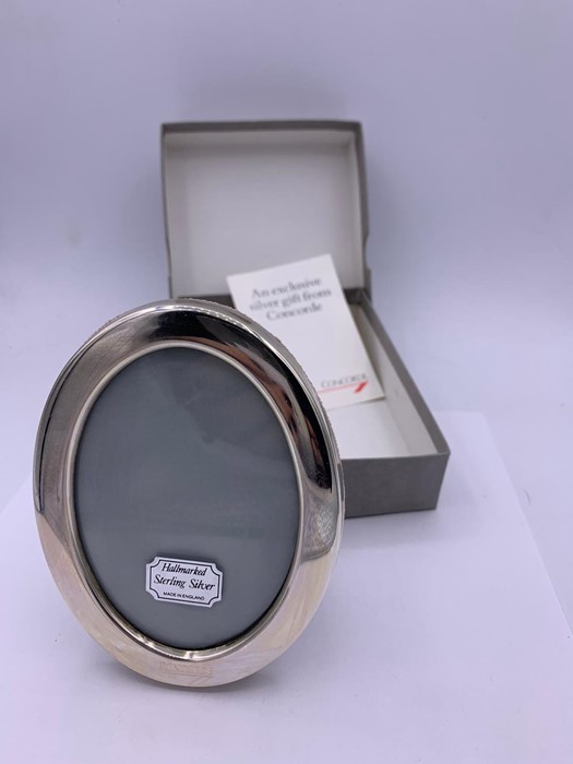 A Concorde Hallmarked silver oval picture frame in original box.