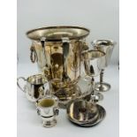 A selection of silver plated items to include an ice bucket, tray etc