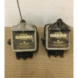 Two vintage taxi meters by Geecen Ltd London with various markings and numbers