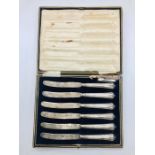 A boxed set of six silver handled knives