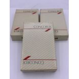 Three packs of Concorde playing cards, one with cards still sealed.