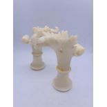 A pair of unusual alabaster carvings, could be candlestick