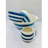 Three T. G. Green and Co ltd Cornish ware bowls and a blue and white striped jug