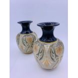 A Pair of Lambeth Doulton vases.