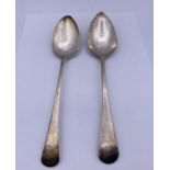 A Pair of Georgian silver serving spoons, makers mark GW and IL