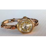 A mid-century ladies wristwatch with hallmarked 9ct gold case and rose gold elastic strap, Swiss