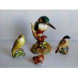 A Royal Worcester dog whistle with puce mark, Marsh Tit, Wood Warbler and Derby China Kingfisher all