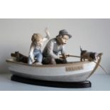 A large Lladro group figure, 'Fishing With Gramps' No.5215, in 'Paloma', modelled by Jose Puche,