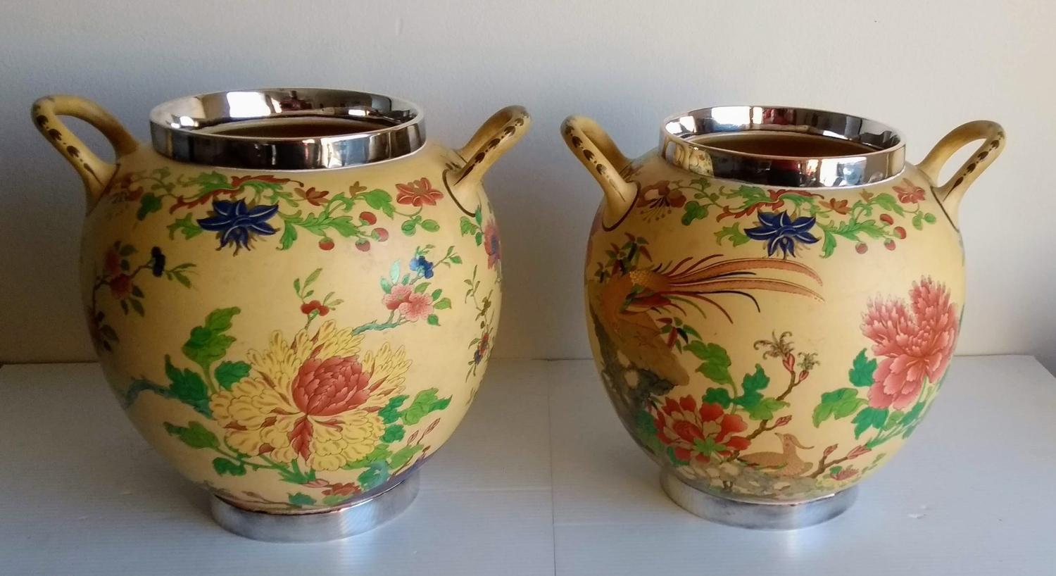 A pair of Wedgwood caneware ivory-ground jars with multicolored floral decoration, hand-painted