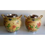 A pair of Wedgwood caneware ivory-ground jars with multicolored floral decoration, hand-painted