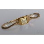 A mid-20th century 9ct gold ladies wristwatch for J.W. Benson, London, Arabic numerals, Swiss