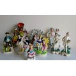 An assortment of 19th century Staffordshire flatbacks and other figurines, without visible damage or