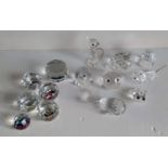 An assortment of Swarovski Crystal figurines of an eagle, falcon hen, dog, cat, frog, fish, etc