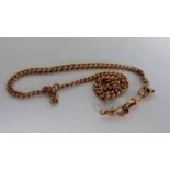 An Edwardian rose gold Albert chain with two clasps, 40 cm, hallmarked, 36.54g