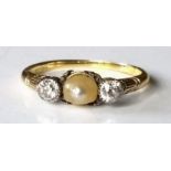 An 18ct yellow gold three-stone pearl and diamond ring, the pearl bead 5.1mm x 4.2mm, peg-set