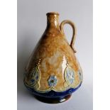 A George V Doulton Lambeth whisky jug with mottled tan-ground and Celtic knot decoration, c.1929,