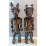 A west African male and female wood tribal pair, possibly Liberia, each 62 cm H