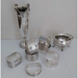 A selection of seven early 20th century silver napkin rings, (two pairs), mixed dates, a salt cellar