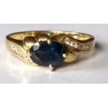 A mid-century sapphire and diamond ring, the mixed cut sapphire 7mm x 5mm x 3.1mm, estimated 1