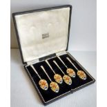 A cased set of six enamelled coffee spoons by Turner & Simpson, Birmingham, 1953, retailed by