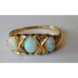 An Edwardian 18ct yellow gold seven-stone opal and diamond ring comprising three oval cabochon-cut