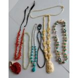 A selection of vintage organic bead necklaces to include, pearl, coral, ivory, etc