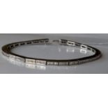 A diamond-set line bracelet on 18ct white gold, comprising rectangular links, twenty-six with six