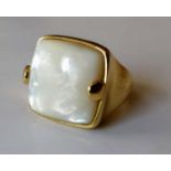 An 18ct yellow gold mother-of-pearl ring: the cushion-shape cabochon 17.4mm 17.5mm x 6.07mm, Italian