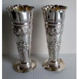 A pair of Victorian silver posy vases with rococo decoration on weighted bases by Josiah