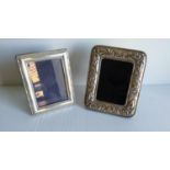 A small modern silver photo frame by John Bull Ltd, Birmingham, 11.5 x 9 cm and another white