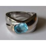 An 18ct white gold blue topaz ring, the oval mixed-cut stone 9 x 6.94 x 4.05mm, test for 18ct