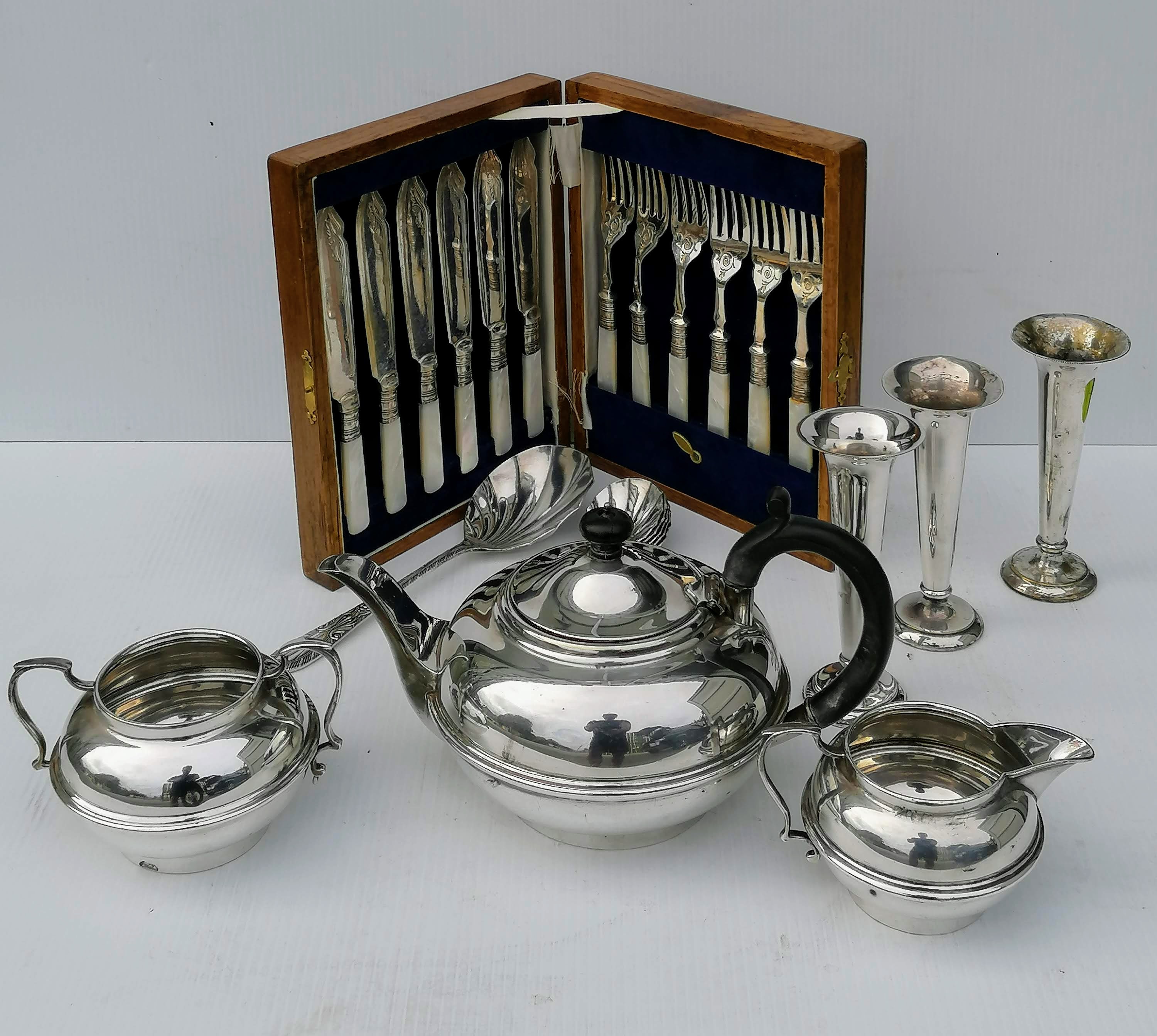 A selection of silver plate including a tea set, tray, tazza, flatware, etc