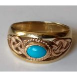 A Clogau Celtic knot turquoise 9ct yellow and rose gold band: the cabochon oval turquoise 6.9mm x