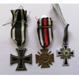 A full size WW1 German 1914 Iron Cross 2nd Class medal with ribbon, War Merit Cross with swords