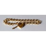 A 9ct gold curb link bracelet with locket, hallmarked, 16g