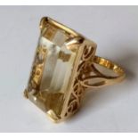 A 9ct yellow gold citrine dress ring on a claw setting, 21.9 x 14.8 x 10.9mm, calculated 25 carat,