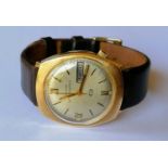 A 1976 Bulova Accuquartz gold cased day/date cushion-shape wristwatch, signed dial 34mm, stamped