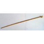 A marine ivory and whalebone walking stick with clenched fist on a plain tapering shaft, 91 cm, chip