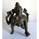 An 18th century four-armed Indian bronze Hindu deity, possibly Durga, with fine incised detail, 11.5