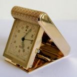 A vintage Cartier folding desk or travel clock, white rectangular signed dial with Arabic