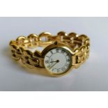 A Raymond Weil ladies gold plated bracelet watch with white dial, roman numerals, date aperture with