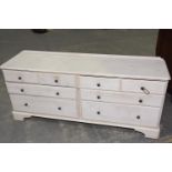 A modern stained pine chest of drawers The rectangular moulded top with rounded front corners