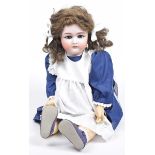 A German bisque headed doll With dark brown wig, open/shut blue eyes, open mouth, impressed mark