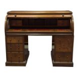 A 19th Century mahogany cylinder top twin pedestal desk The fall front enclosing a compartmentalized