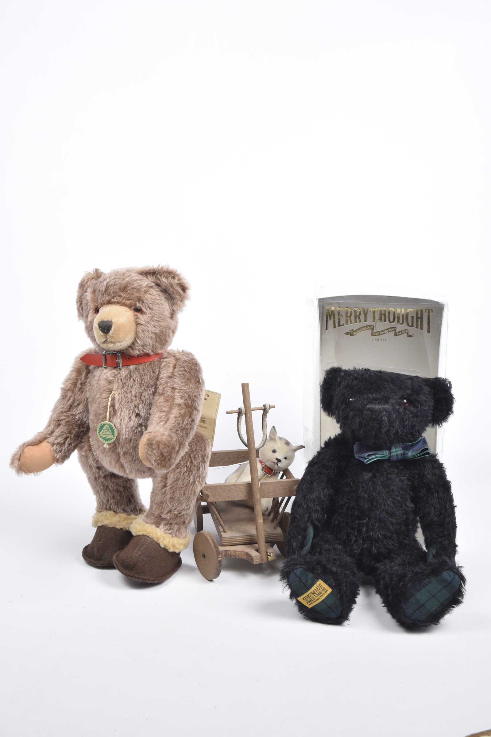 A boxed Merrythought SHS 14FST Black Watch bear, no. 154/750 Height 35cm, unboxed Hermann brown